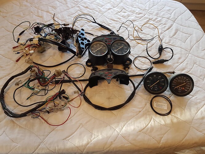 Clocks mounted + clocks + cables + idiot light buld holders + dash wiring + Ign + key